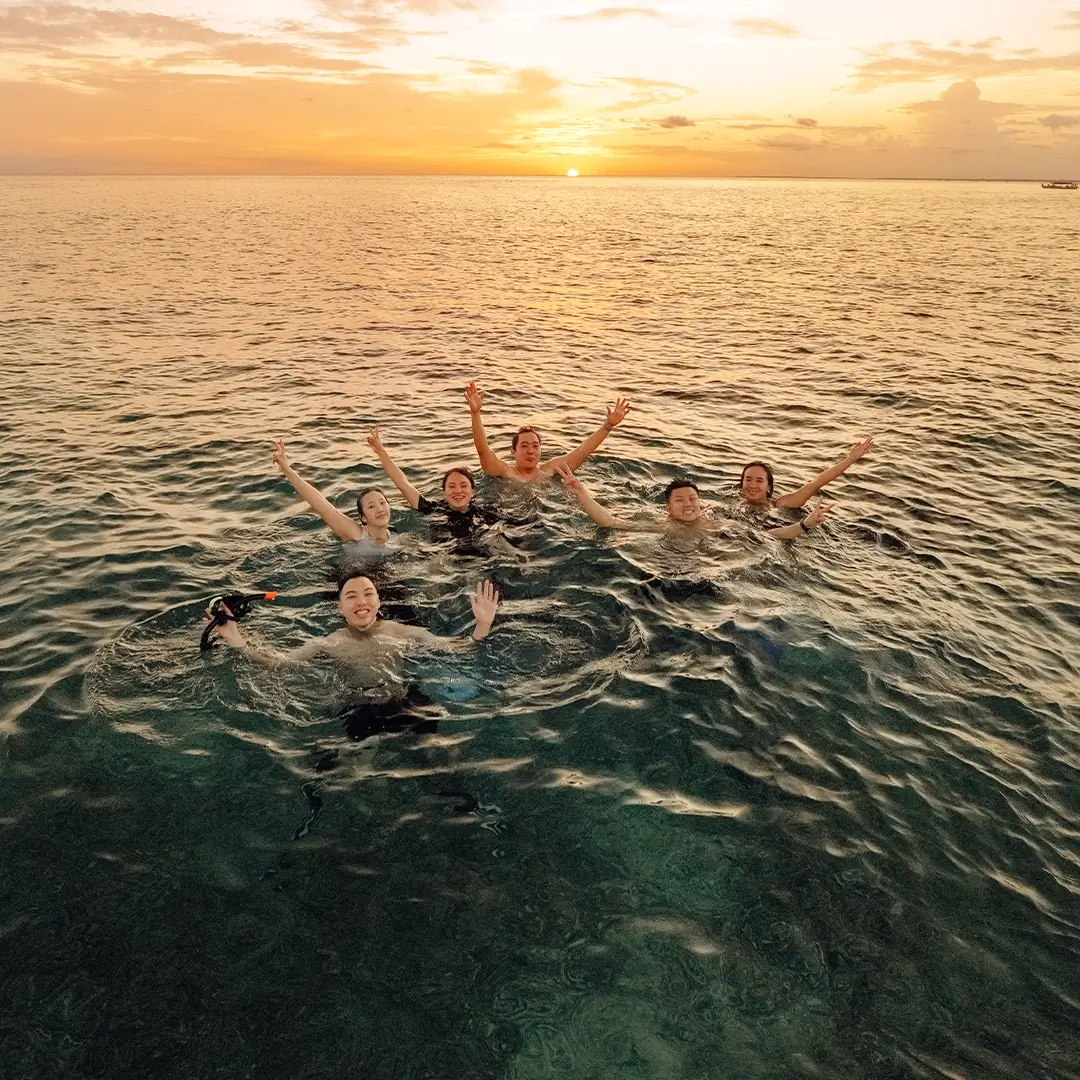 Swim & watch the sunset dip into the sea from a sandbar.